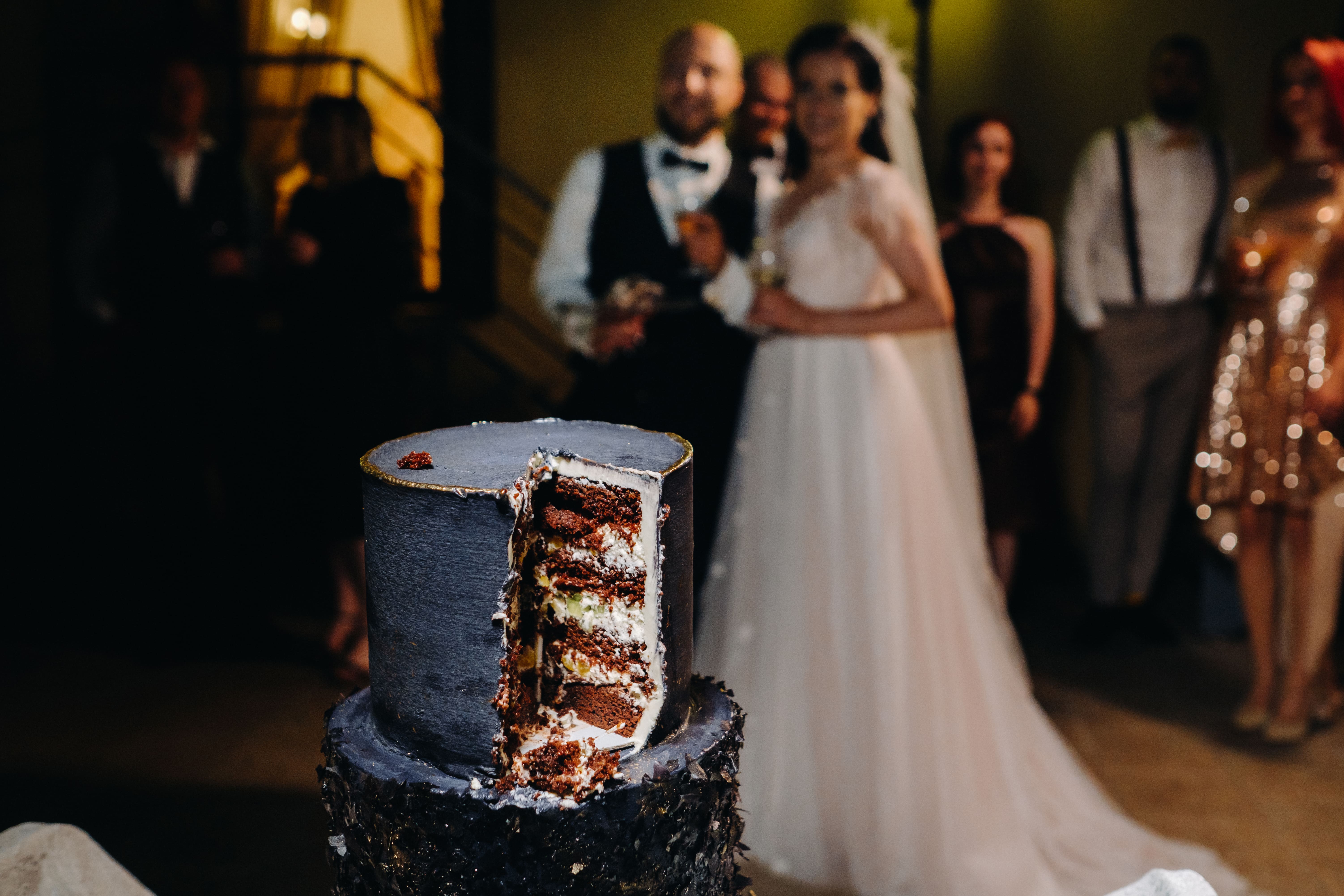A close-up cut of a wedding cake at a wedding